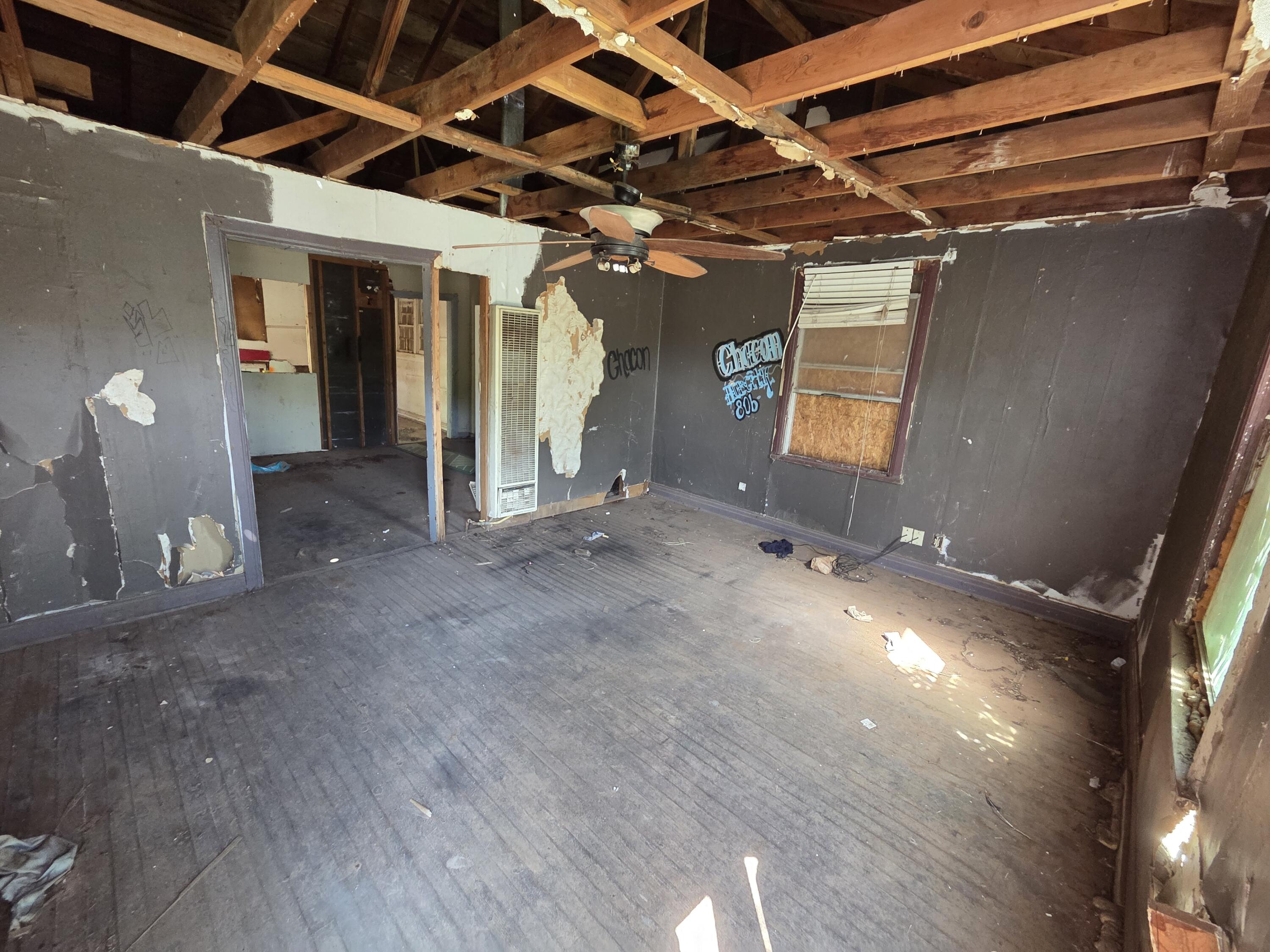 1106 35th Street Lubbock, TX 79412 - Photo 2 of 15 a view of a room with wooden floor