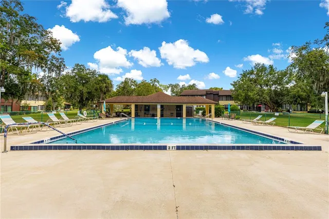a view of a yard with swimming pool