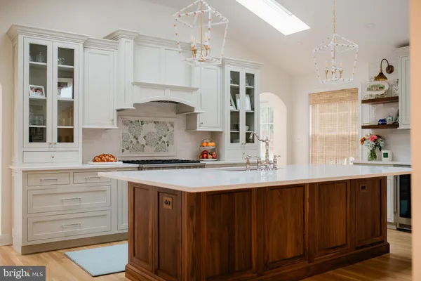 a kitchen with a sink cabinets and window