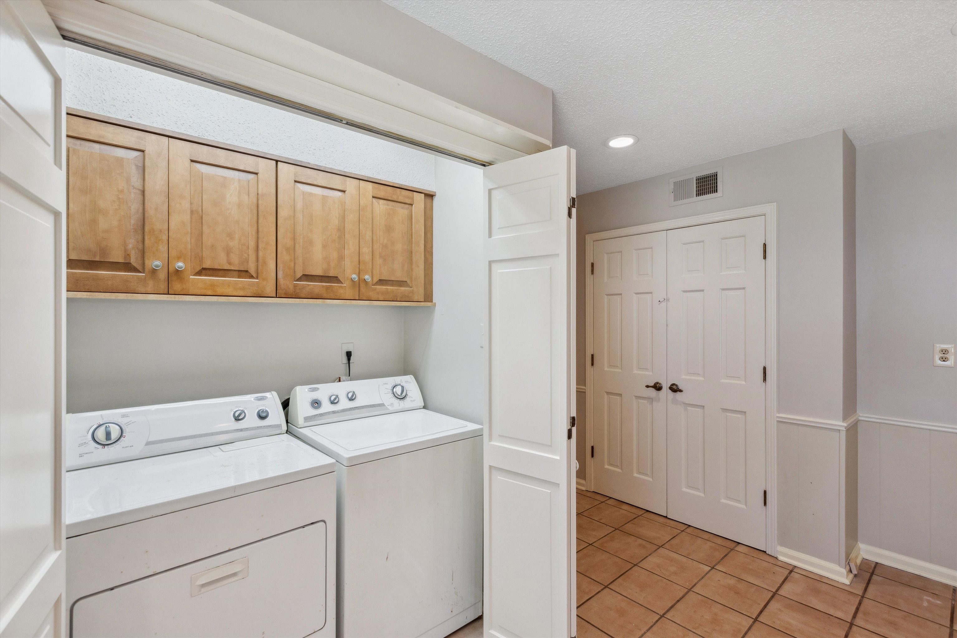 7617 Hollow Fork Road Germantown, TN 38138 - Photo 16 of 28 a view of storage and utility room with washer and dryer