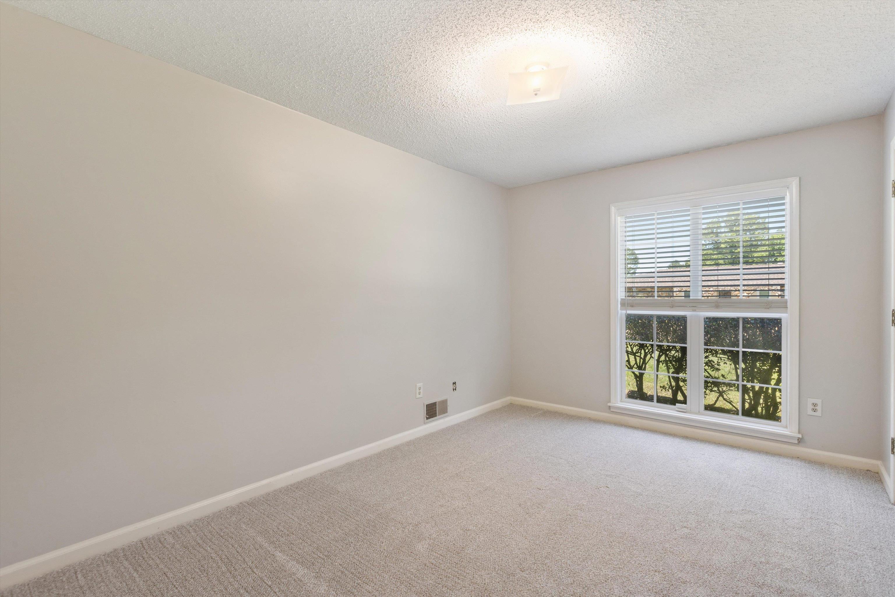 7617 Hollow Fork Road Germantown, TN 38138 - Photo 20 of 28 an empty room with windows