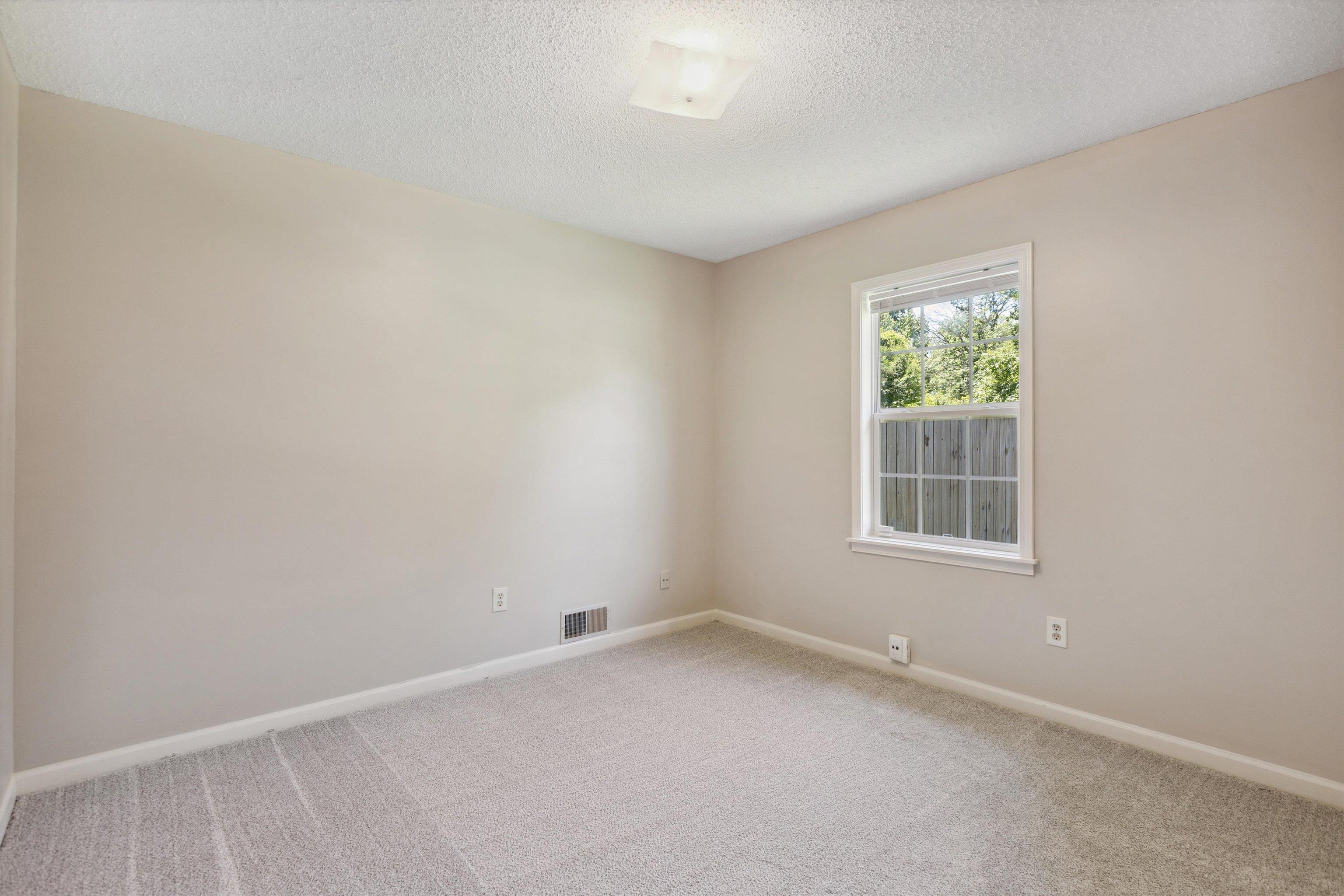 7617 Hollow Fork Road Germantown, TN 38138 - Photo 23 of 28 an empty room with a window