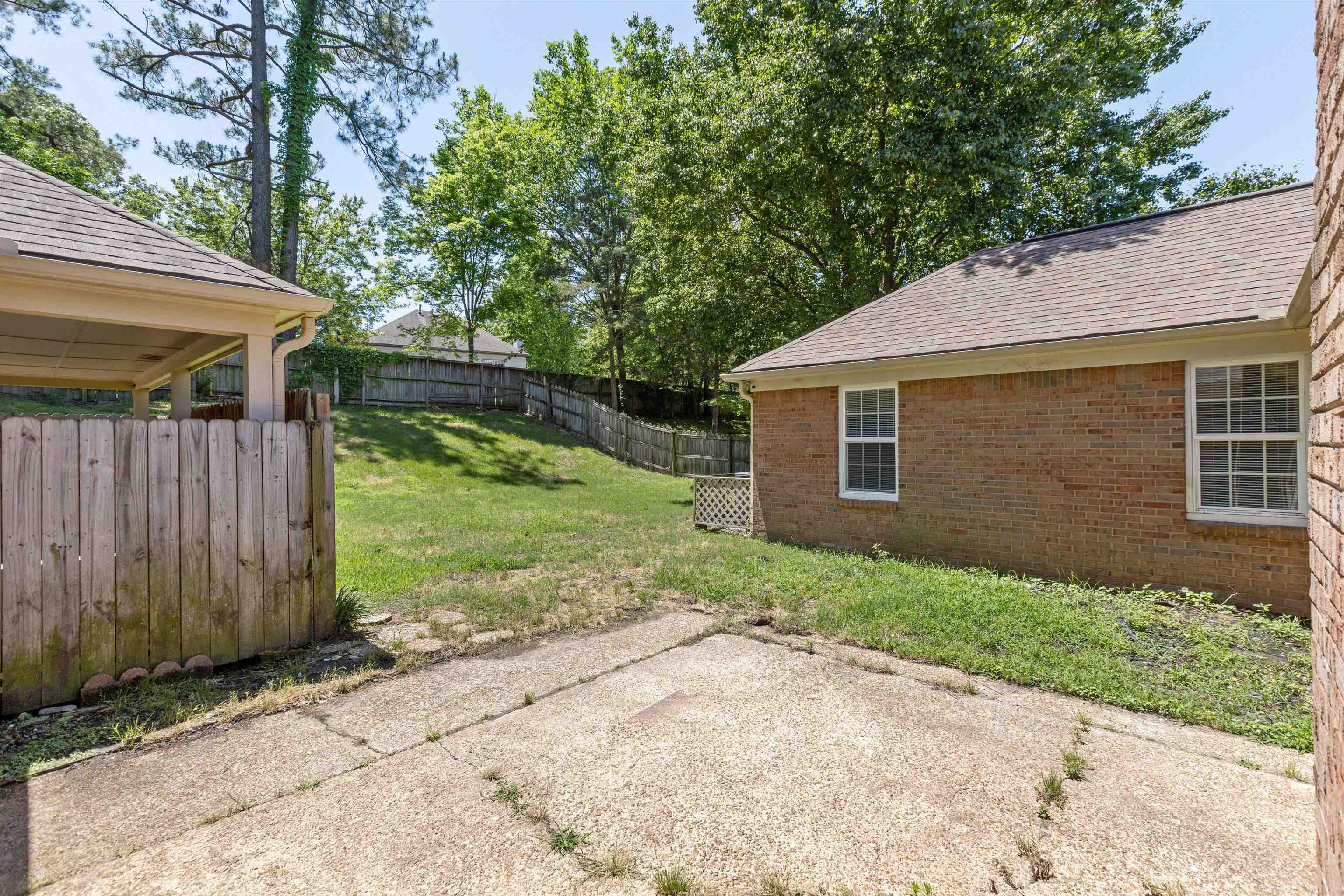 7617 Hollow Fork Road Germantown, TN 38138 - Photo 24 of 28 a front view of a house with garden