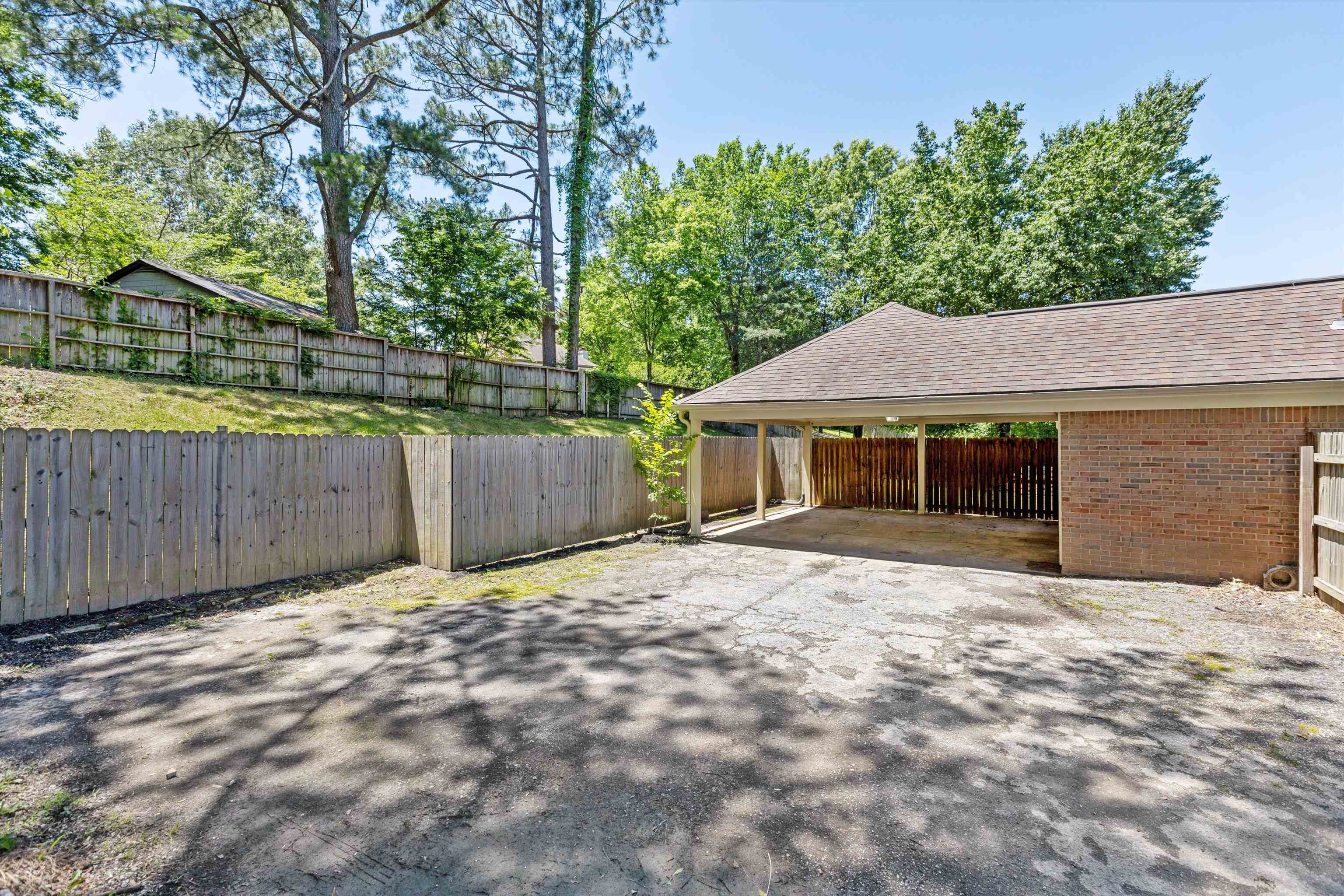 7617 Hollow Fork Road Germantown, TN 38138 - Photo 27 of 28 a front view of a house with a garden