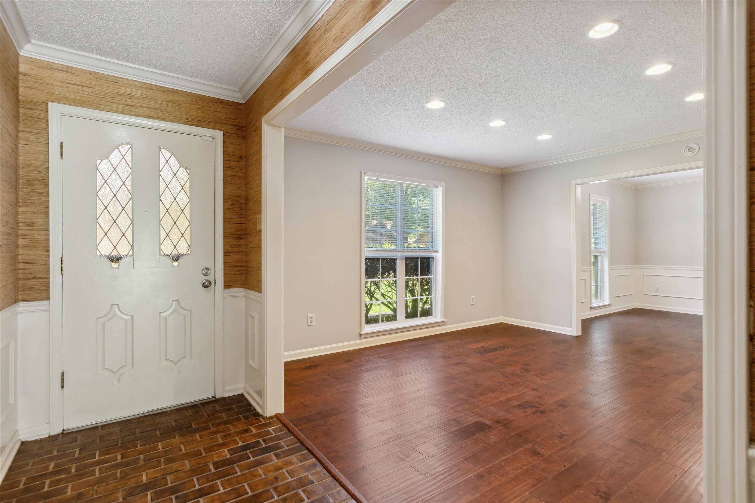 7617 Hollow Fork Road Germantown, TN 38138 - Photo 5 of 28 a view of an empty room with wooden floor and a window