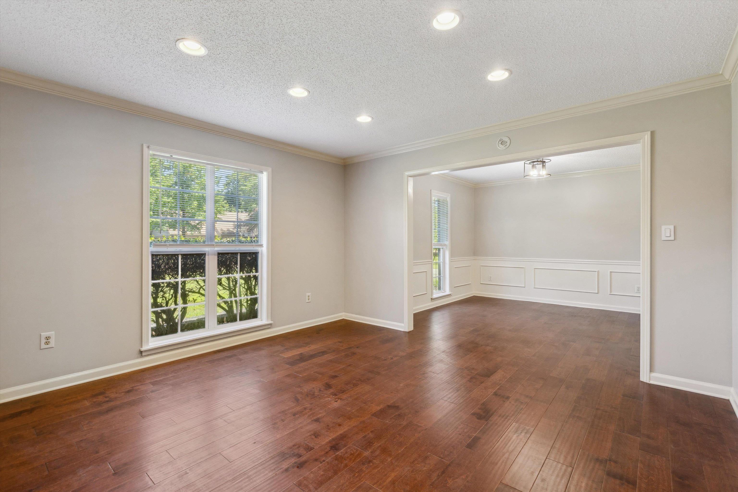 7617 Hollow Fork Road Germantown, TN 38138 - Photo 6 of 28 an empty room with wooden floor and windows