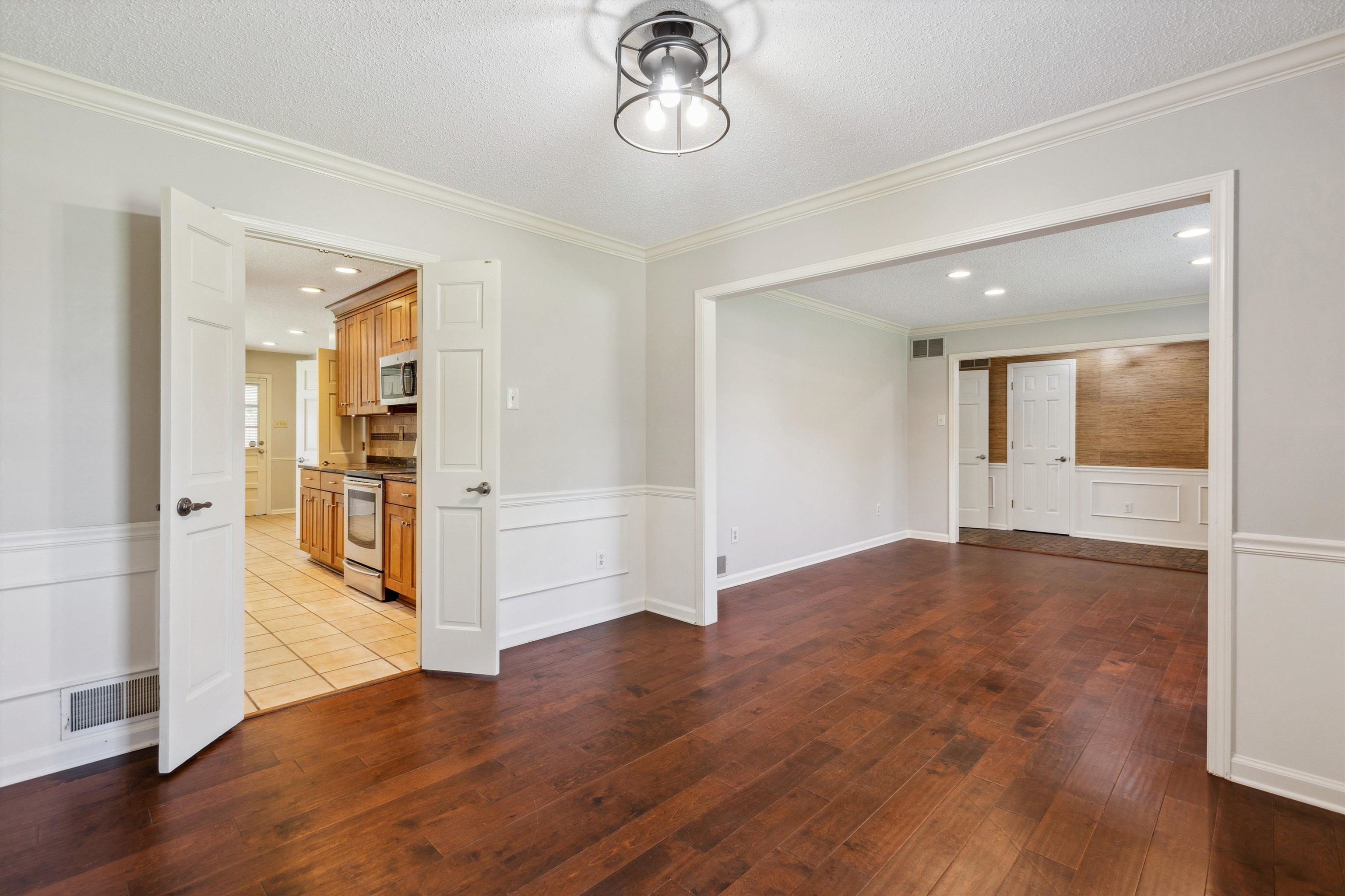 7617 Hollow Fork Road Germantown, TN 38138 - Photo 9 of 28 wooden floor in an empty room with a window