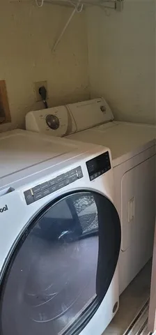 a utility room with washer and dryer