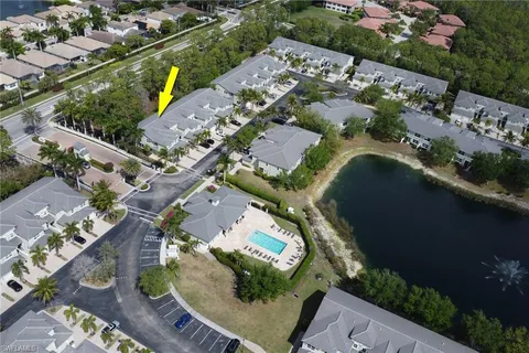 an aerial view of a residential houses with outdoor space