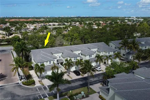 an aerial view of multiple house with yard