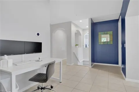 a view of a workspace with furniture