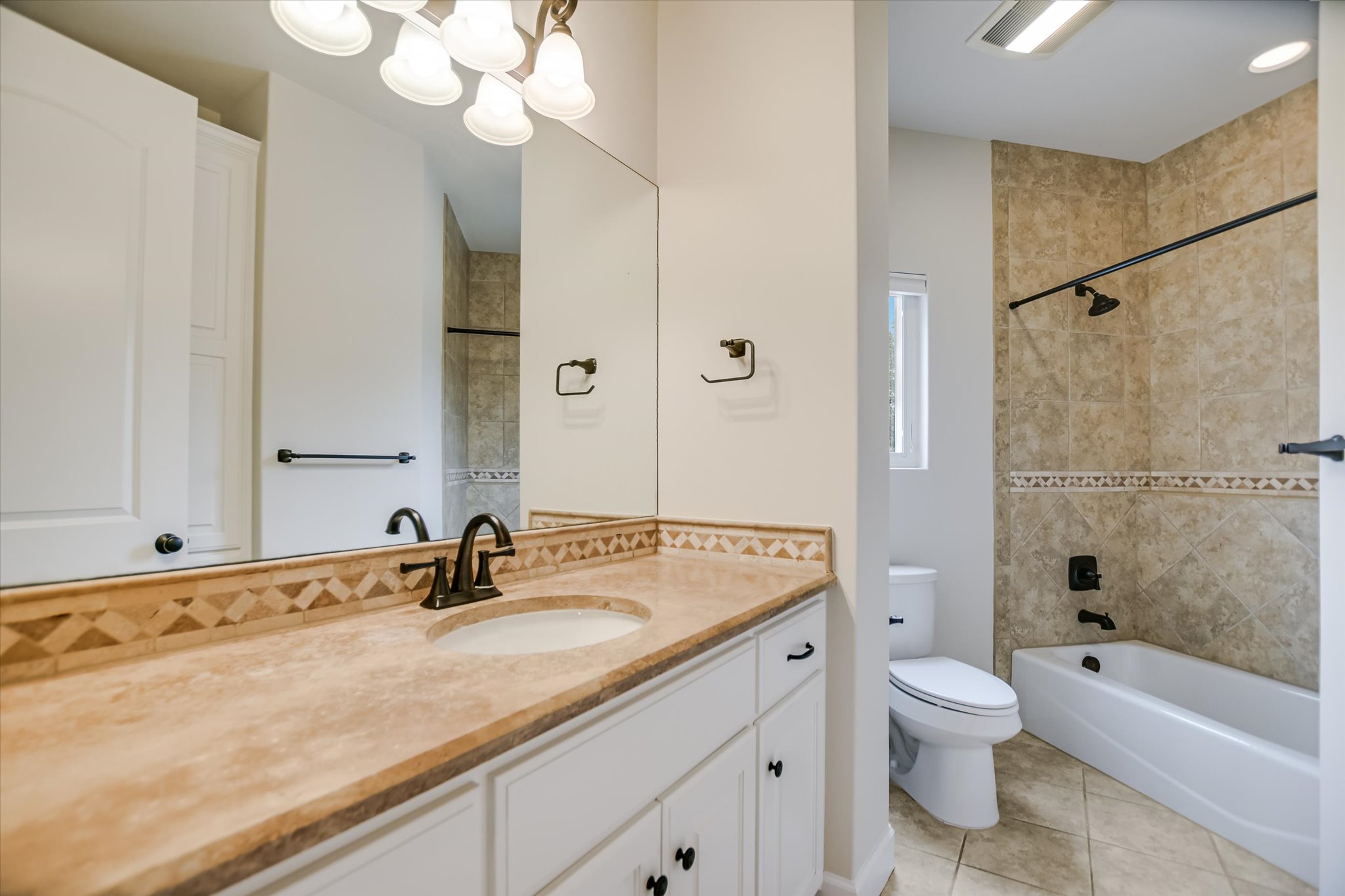 11 Inwood Circle Austin, TX 78746 - Photo 24 of 38 Granite counters and tiled walls define this well-appointed bath.
