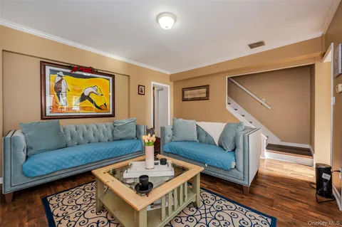 a living room with furniture and a rug