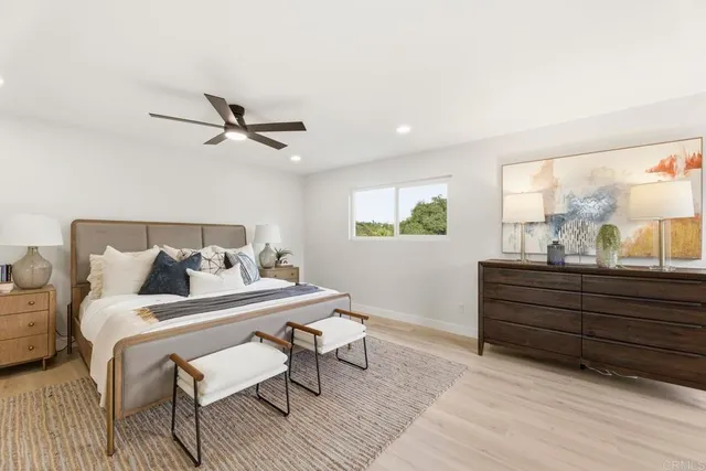 a bed room with a bed and a window