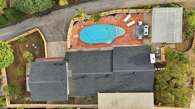 an aerial view of residential building with parking
