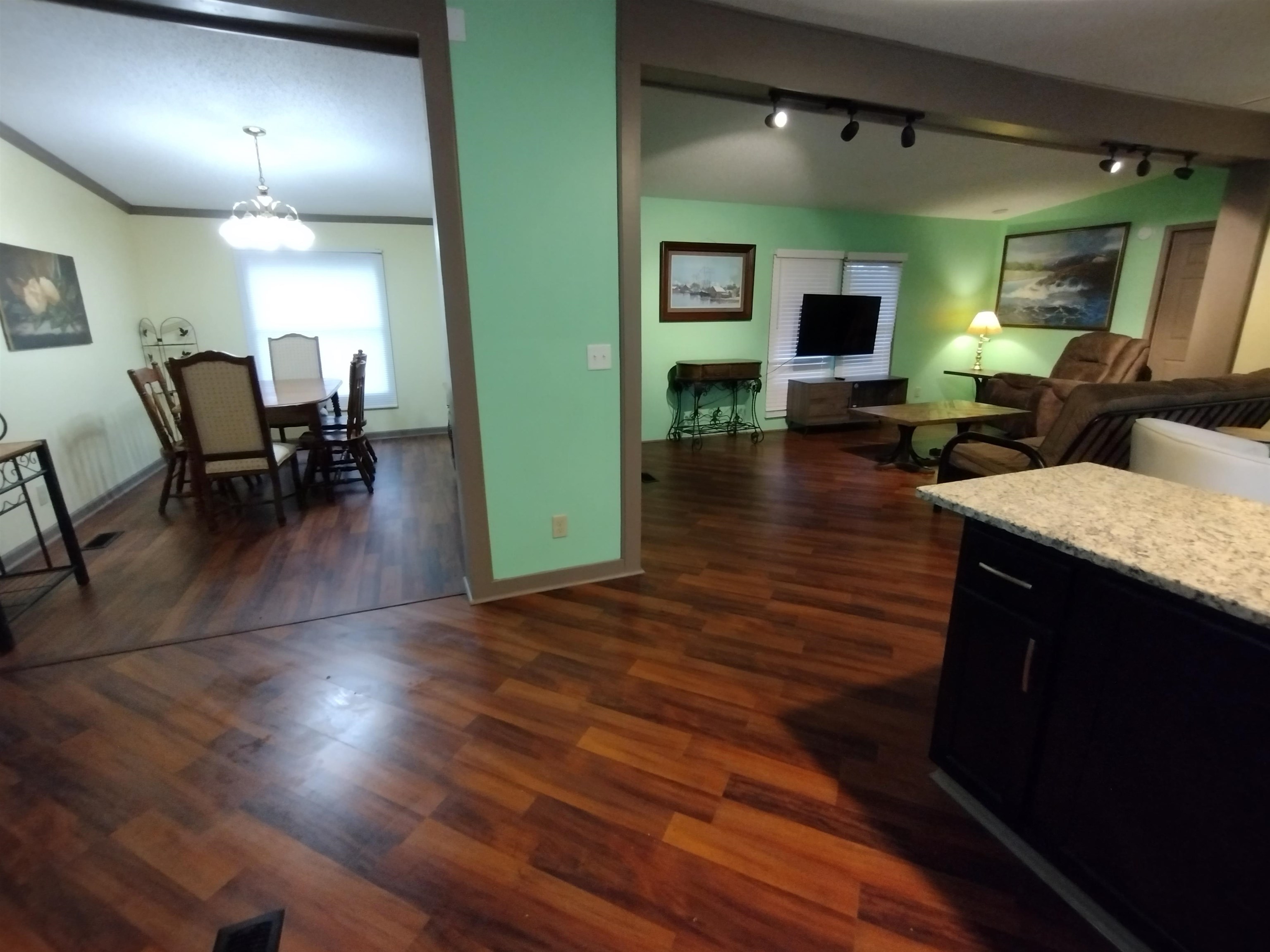 348 Sanford Road Covington, TN 38019 - Photo 23 of 23 a living room with furniture and a wooden floor