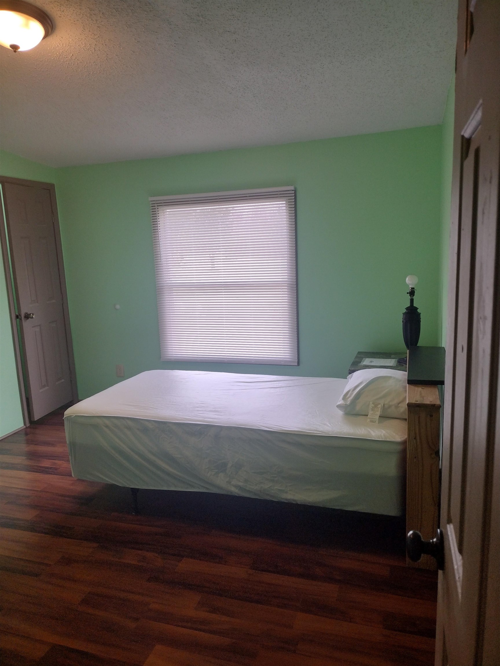 348 Sanford Road Covington, TN 38019 - Photo 4 of 23 a bedroom with a bed and a window