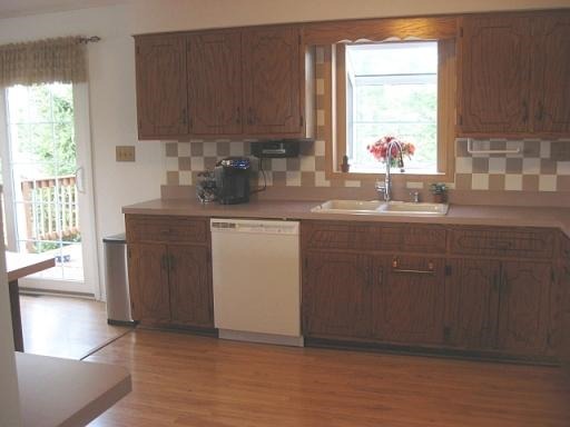 1029 South Cooper Road New Lenox, IL 60451 - Photo 6 of 11 a kitchen with a sink cabinets and window