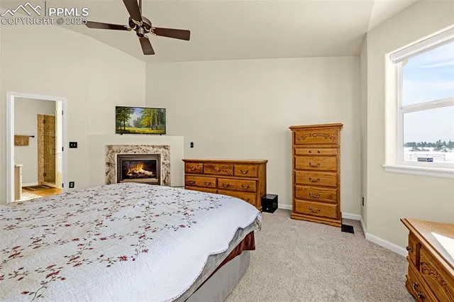 a bedroom with a bed and a television