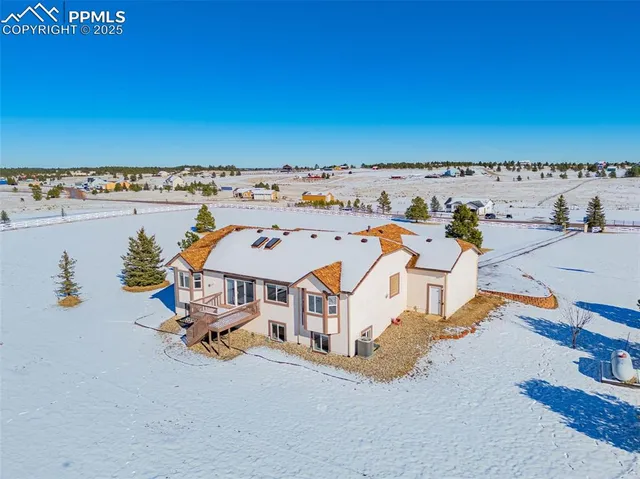an aerial view of a house with a outdoor space