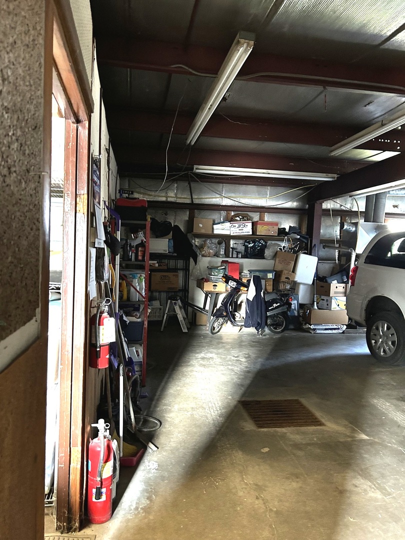 1901 1st Avenue Mendota, IL 61342 - Photo 3 of 14 a view of a garage with a bike and a car
