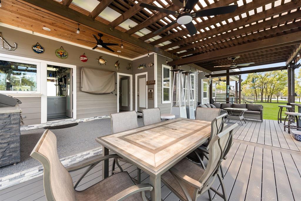 13032 Rudy's Way Streetman, TX 75859 - Photo 31 of 40 Outdoor dining area under the covered patio, ideal for entertaining after a day on the lake.