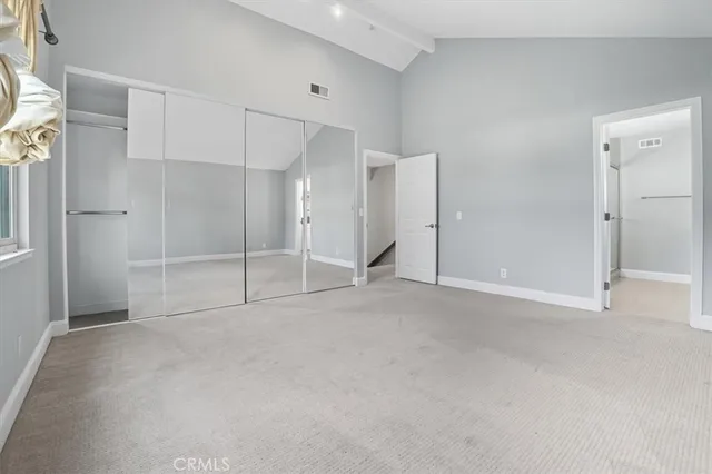 a kitchen with granite countertop a sink and a refrigerator