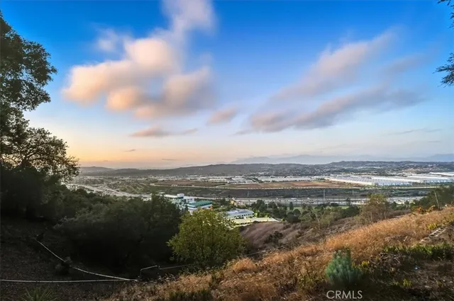 a view of a city with mountains in front of it