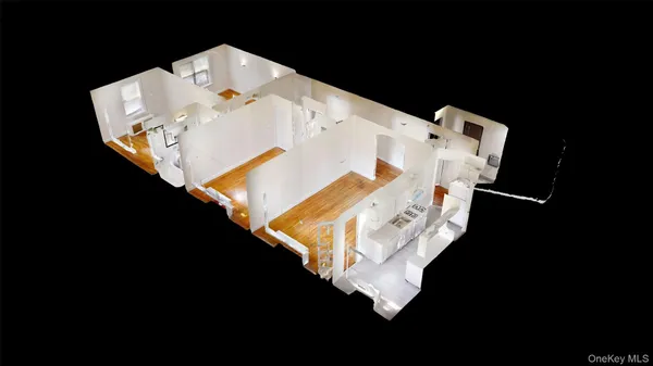 a white bed sitting in a middle of a room