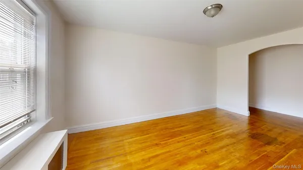 a view of an empty room and window