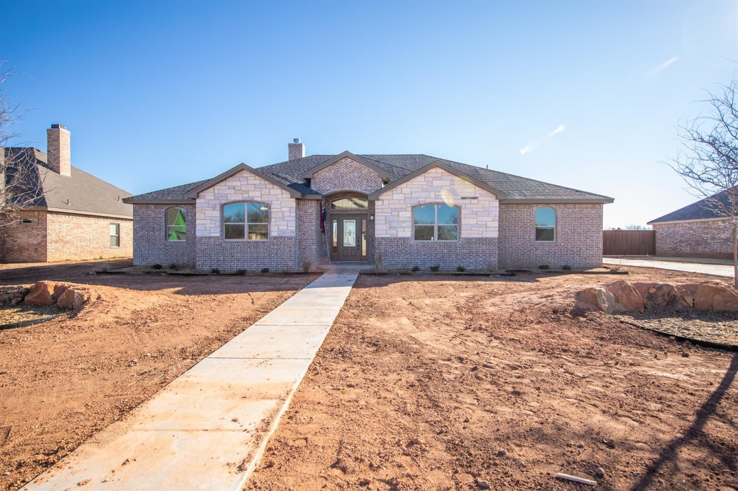 13311 Gardner Lubbock, TX 79424 - Photo 1 of 32 a front view of a house with a yard