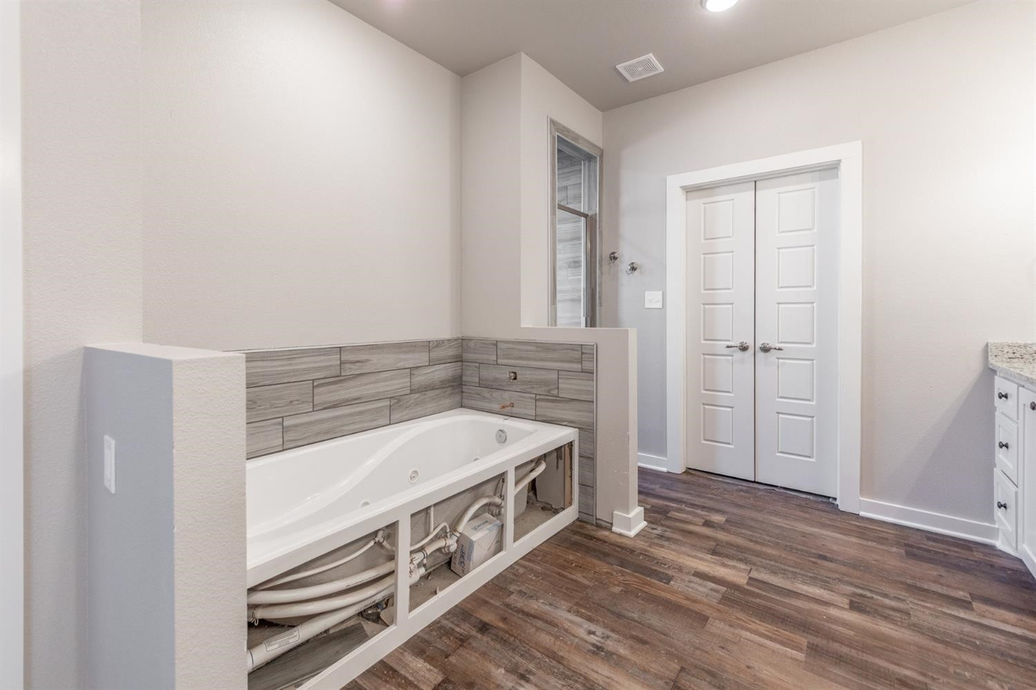 13311 Gardner Lubbock, TX 79424 - Photo 13 of 32 a bathroom with a double vanity sink and a mirror