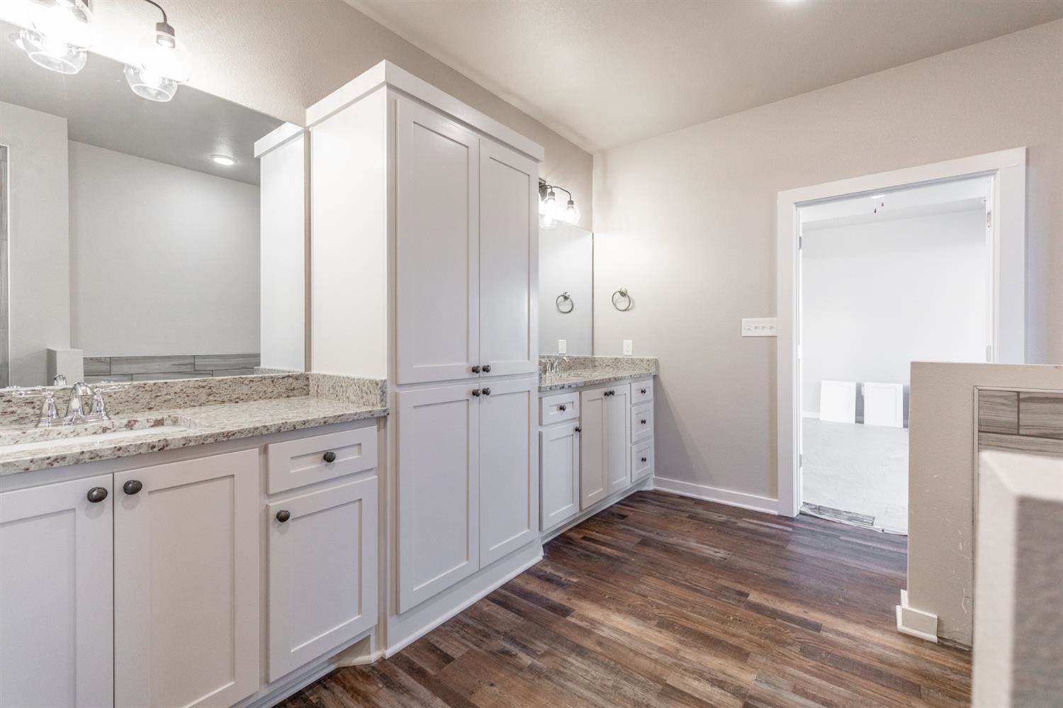 13311 Gardner Lubbock, TX 79424 - Photo 14 of 32 a bathroom with a granite countertop sink and a mirror