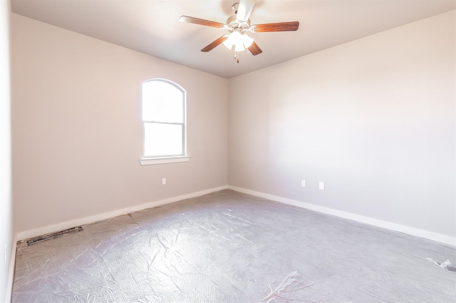 13311 Gardner Lubbock, TX 79424 - Photo 16 of 32 an empty room with a window and a fan