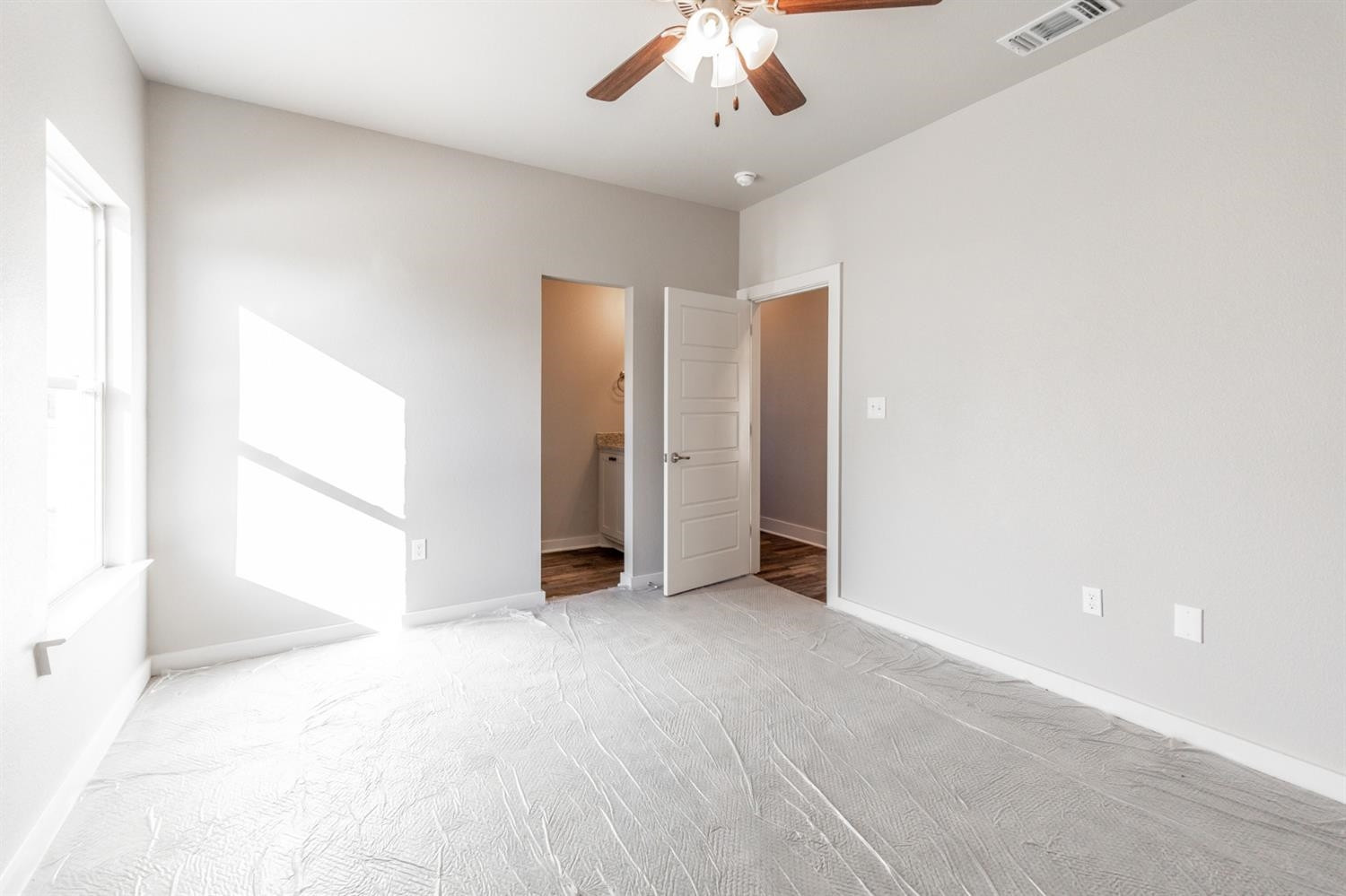 13311 Gardner Lubbock, TX 79424 - Photo 21 of 32 an empty room with a ceiling fan and a window