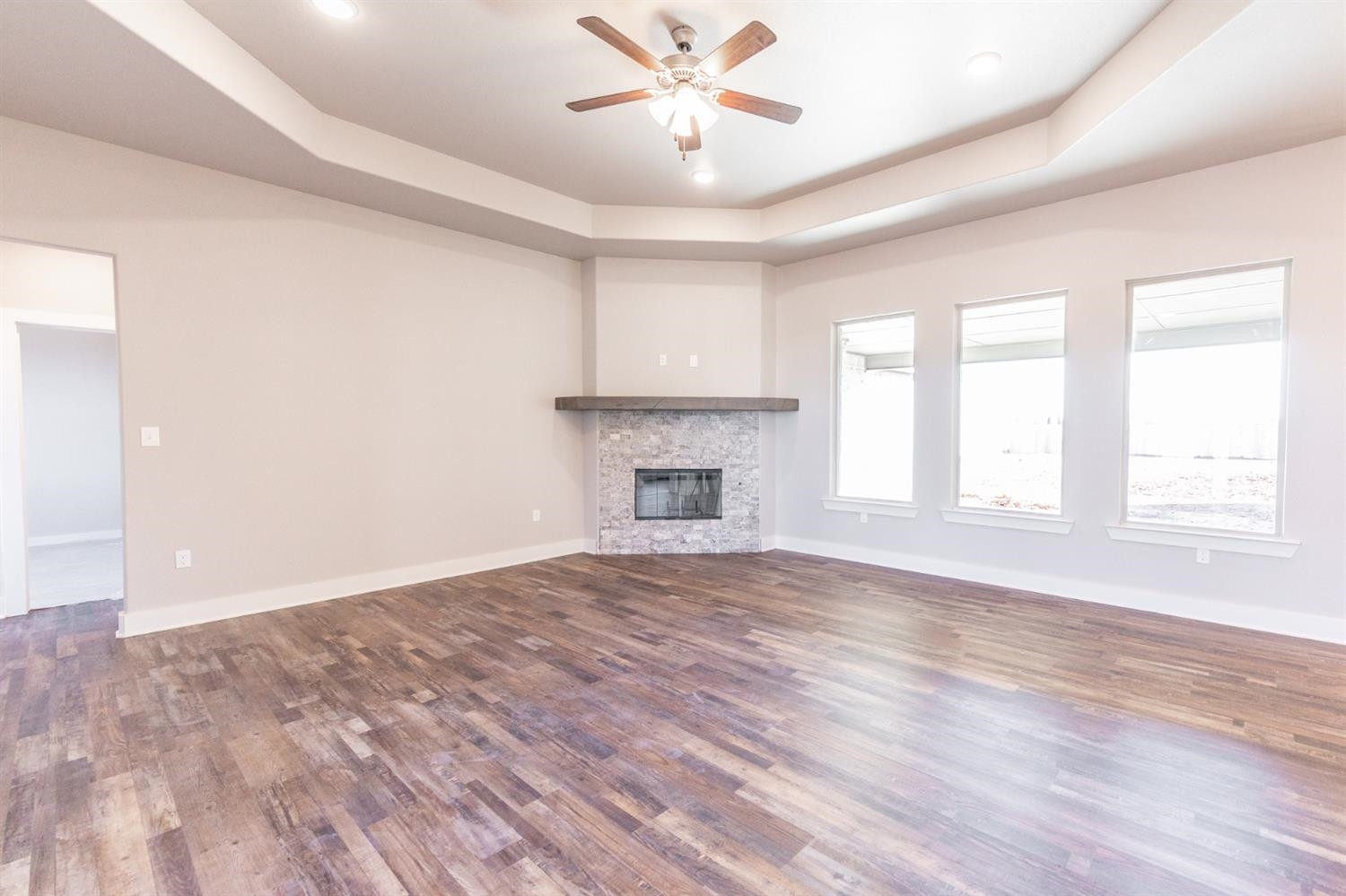 13311 Gardner Lubbock, TX 79424 - Photo 3 of 32 a view of an empty room with a window and a fireplace