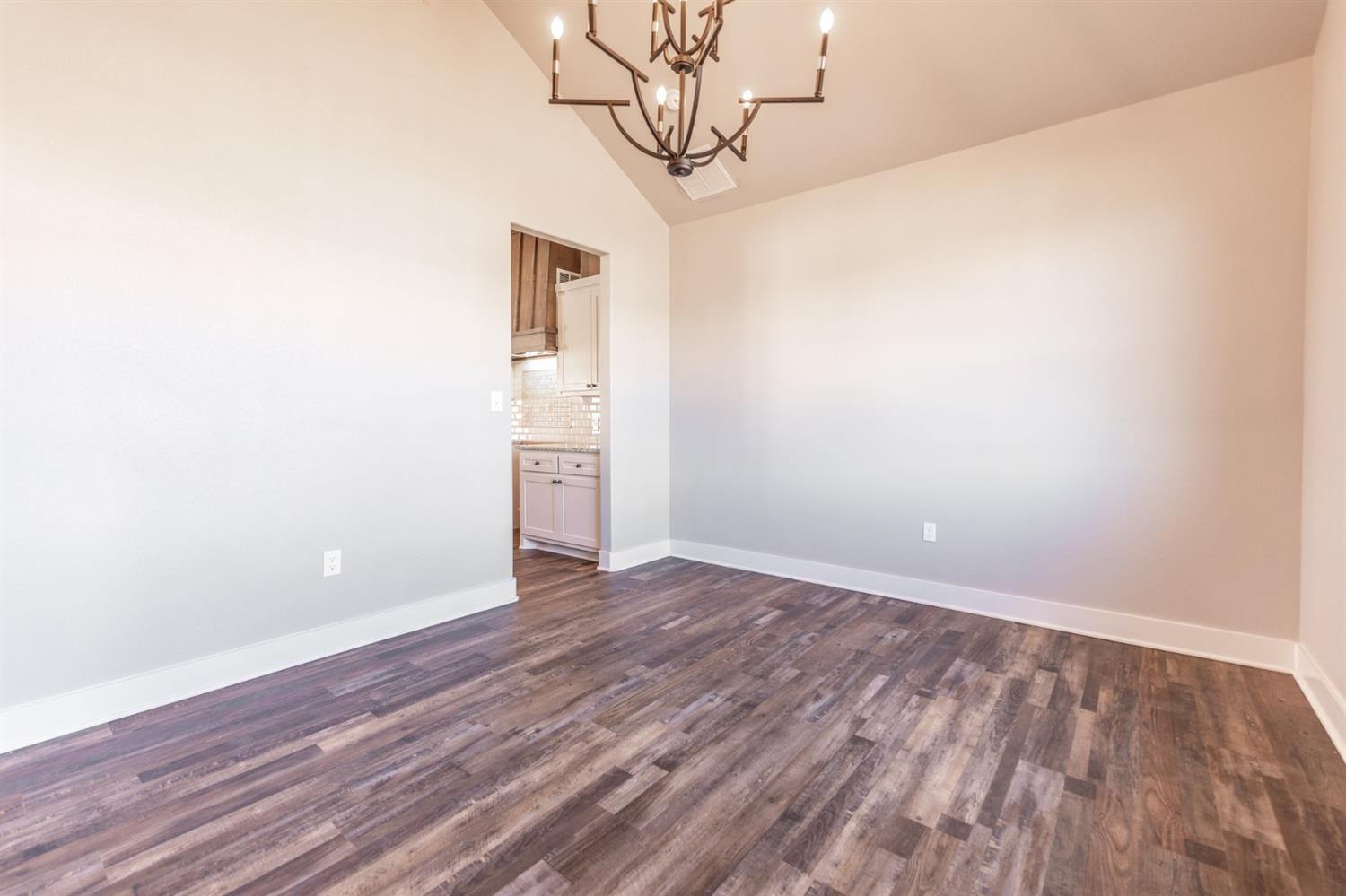 13311 Gardner Lubbock, TX 79424 - Photo 10 of 32 a view of a room with wooden floor and a ceiling fan