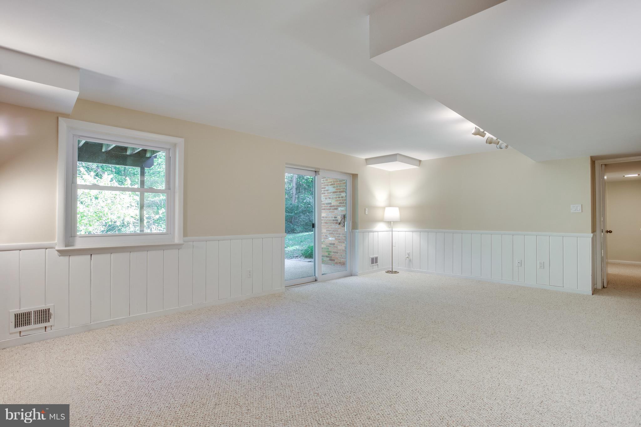 6503 Cardigan Road Bethesda, MD 20817 - Photo 14 of 30 Family room, with sliding door to patio