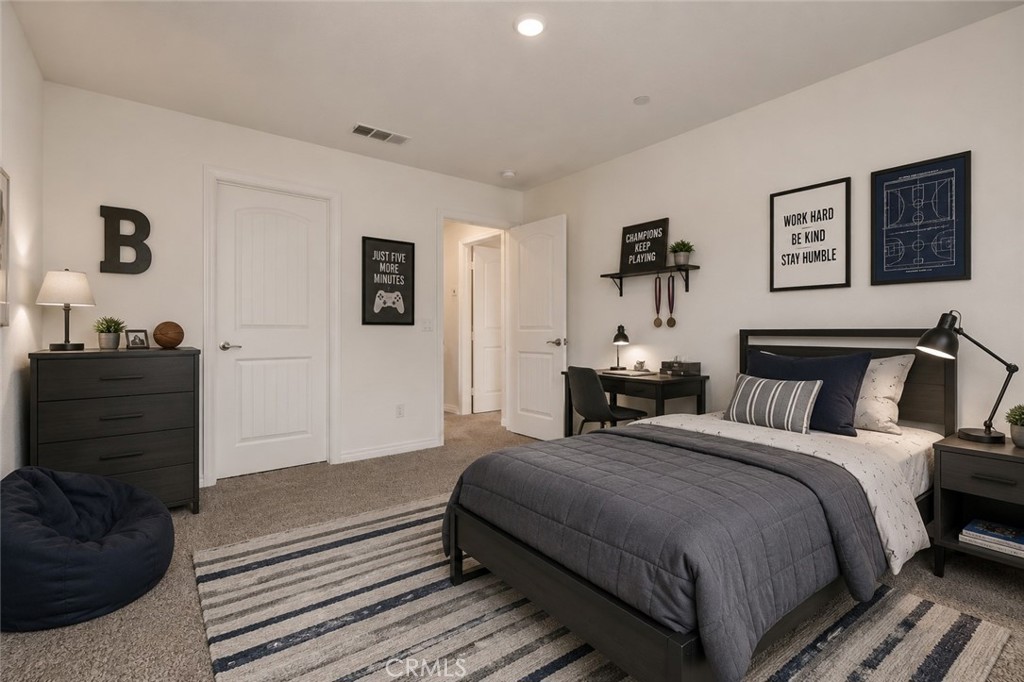 11056 Guffey Ranch Way Corona, CA 92883 - Photo 35 of 61 a bedroom with bed and night stand
