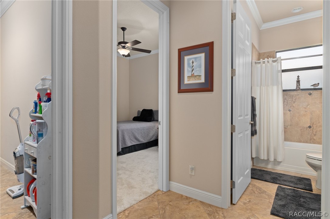 2015 North Rhodes Point Hernando, FL 34442 - Photo 25 of 82 Heading into the guest area you will find the guest bedroom (center door), the guest bath (right), and entry to the laundry room (left). This area can be closed off by a pocket door off of the Great Room, turning this area into a secluded guest area.
