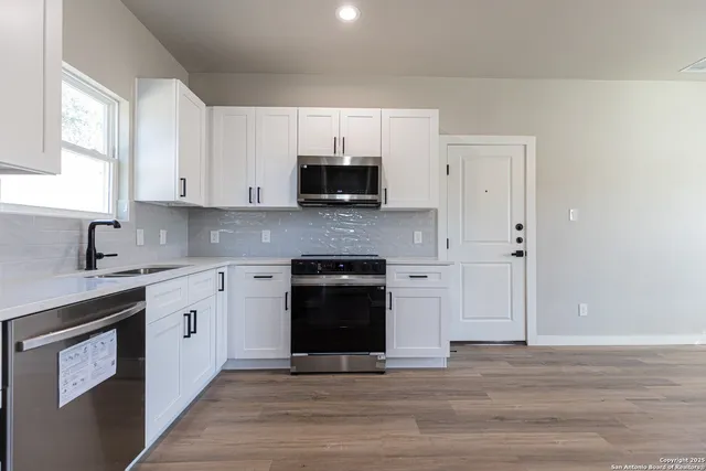 a bathroom with a sink toilet and mirror