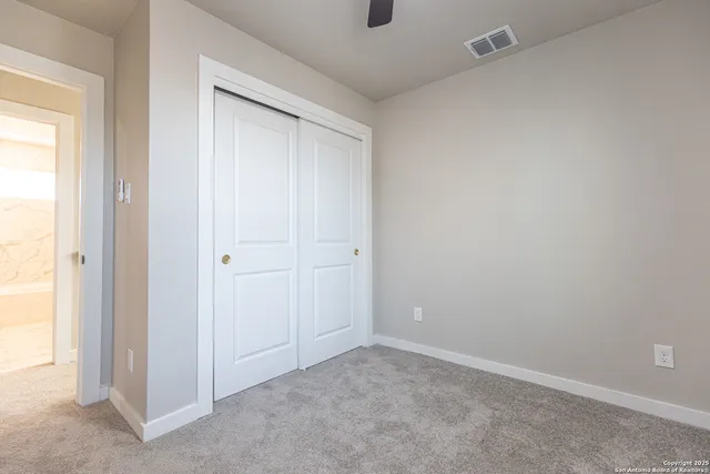 a bathroom with a sink a toilet a mirror a bathtub and shower