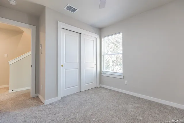 a view of room that has a wooden floor
