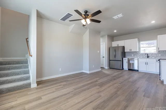 a view of kitchen with wooden floor