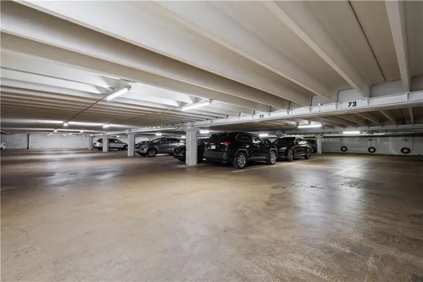a swimming pool with yard and trees in the background
