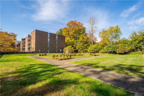 an aerial view of a house with a lake view