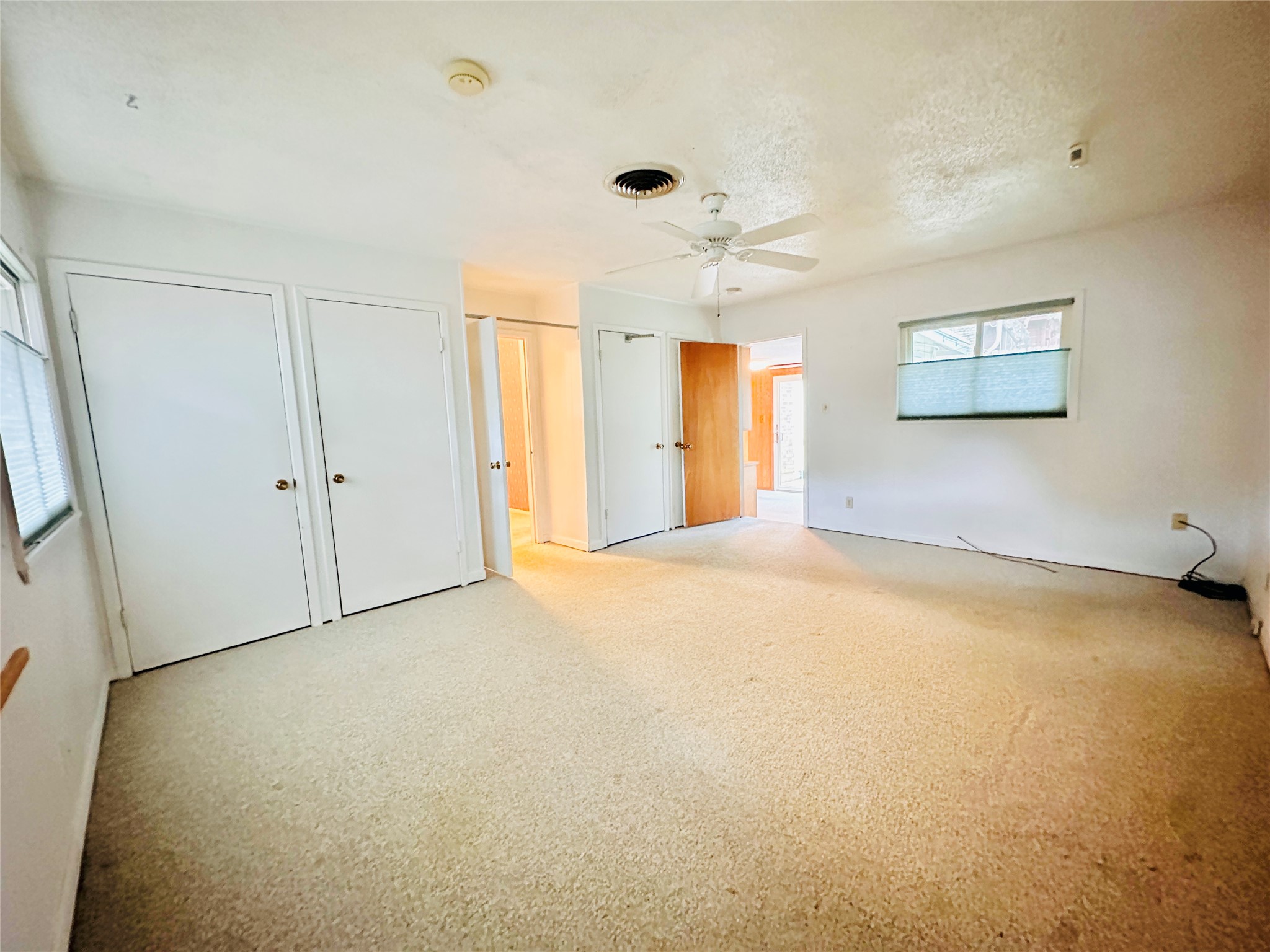 1704 Parkside Lane Austin, TX 78745 - Photo 21 of 39 Primary bedroom overlooks backyard, and has 4 wall closets and so much space!
