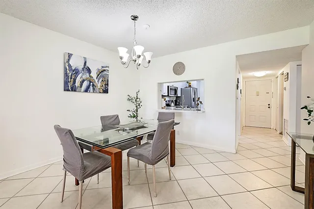 a bathroom with a sink a mirror and a shower curtain