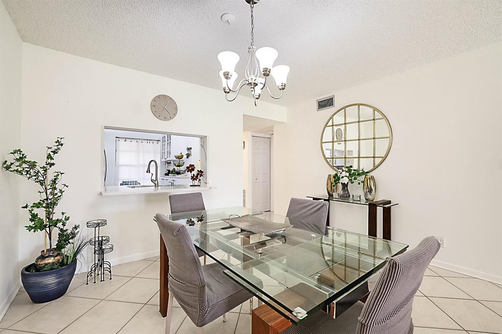 3485 Environ Boulevard, Unit C106 Lauderhill, FL 33319 - Photo 16 of 33 a view of a dining room with furniture