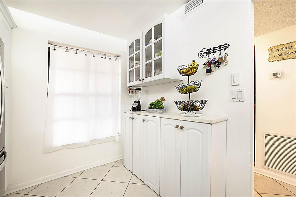 3485 Environ Boulevard, Unit C106 Lauderhill, FL 33319 - Photo 19 of 33 a bathroom with a sink a mirror and a shower curtain